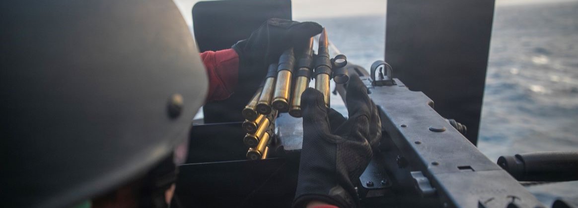 Aviation Ordnanceman 3rd Class Samantha Gonzalez loads ammo into a .50-caliber machine gun during a gun shoot aboard America-class amphibious assault ship USS Tripoli (LHA 7), Mar. 16, 2026. Tripoli is underway conducting routine operations in the U.S. 7th Fleet area of operations. U.S. 7th Fleet is the U.S. Navy’s largest forward-deployed numbered fleet and routinely interacts and operates with allies and partners in preserving a free and open Indo-Pacific region.