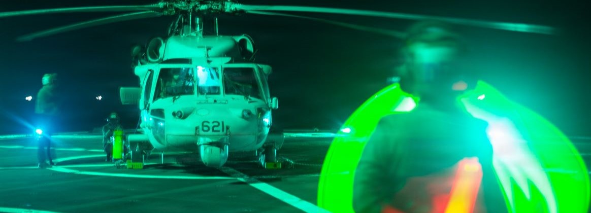 Aviation Electrician’s Mate 3rd Class Jonathan Zazueta signals the crew of an MH-60S Sea Hawk helicopter attached to Helicopter Sea Combat Squadron (HSC) 12 aboard U.S. 7th Fleet flagship USS Blue Ridge (LCC 19) in the South China Sea, March 23, 2026. Blue Ridge and embarked U.S. 7th Fleet staff conduct regular Indo-Pacific patrols to deter aggression, strengthen alliances and partnerships, and advance future warfighting capabilities. (U.S. Navy photo by Mass Communication Specialist Seaman Zachary Del Rio)