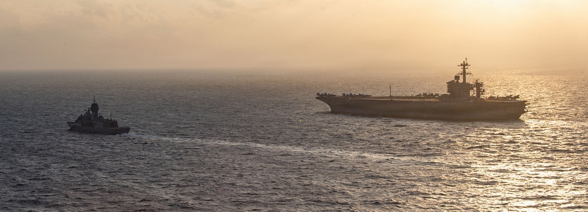 George Washington sails alongside HMAS Perth 