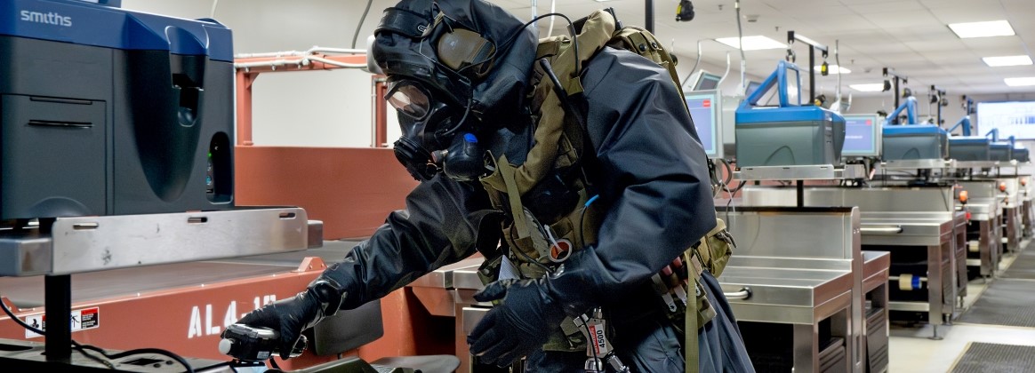  Service members assigned to Explosive Ordnance Disposal Mobile Unit FIVE (EODMU 5) conduct an Improvised Explosive Device (IED) drill at the A.B. Won Pat International Airport 