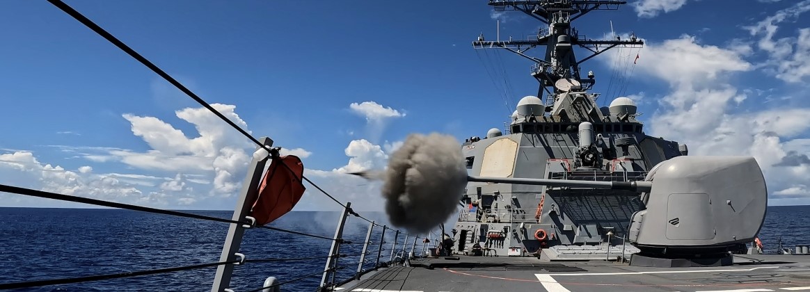 The Arleigh Burke-class guided-missile destroyer USS Milius (DDG 69) fires the Mark 45 5-Inch light-weight gun during a live-fire weapons exercise in the Indian Ocean, July 24, 2025.