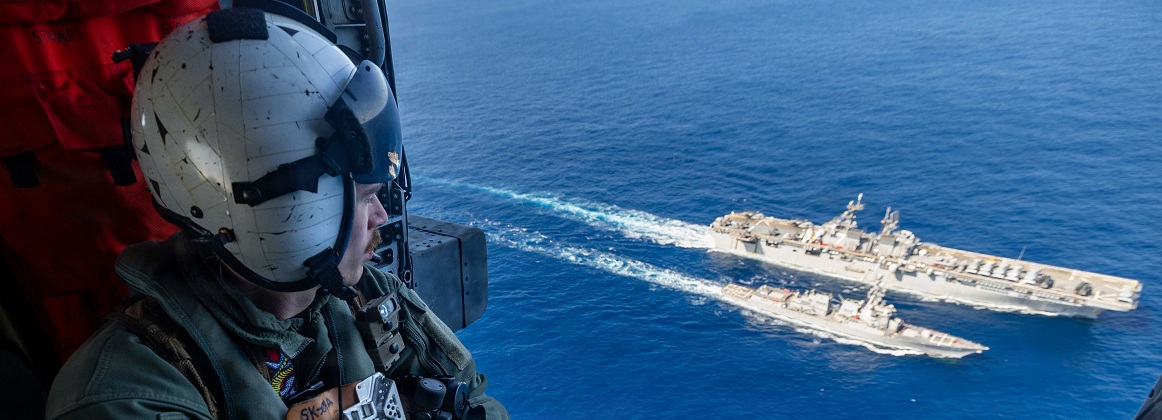 USS Rafael Peralta receives fuel from USS Tripoli