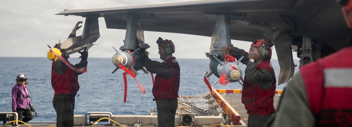 U.S. Marines Load Ordnance onto F35 Aboard USS Tripoli